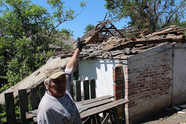 Russia`s hybrid forces attack Maryinka, damage civilians` houses