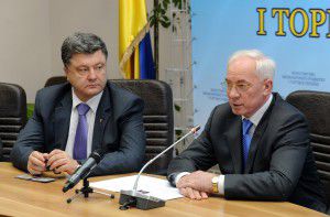 Poroshenko and Azarov (former PM, who help Poroshenko get the position Minister of Economic Development and Trade when the President was Yanukovych)