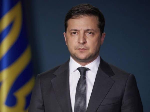 Ukrainian President Volodymyr Zelenskiy makes his TV address to the nation in Kyiv, Ukraine, Friday, March 13, 2020. Zelenskiy said Ukraine to close its borders for foreign citizens from March 16 within the framework of the anti-coronavirus state program. For most people, the new coronavirus causes only mild or moderate symptoms, such as fever and cough. For some, especially older adults and people with existing health problems, it can cause more severe illness, including pneumonia. (Ukrainian Presidential Press Office via AP)