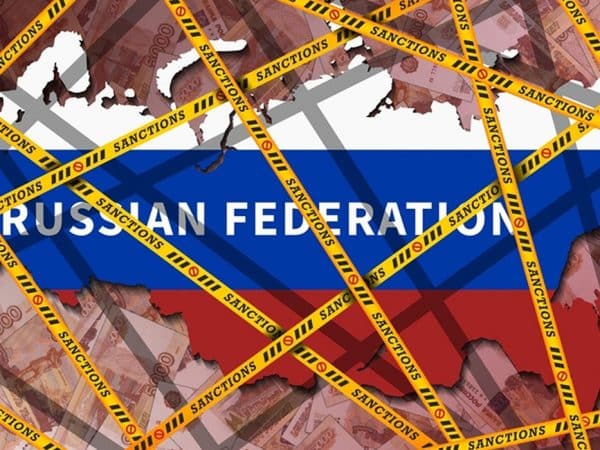 Yellow ribbons with the inscription, sanctions, wrapped around the map of the Russian Federation, painted in the colors of the flag. Economic isolation of Russia. Banknotes 5000 rubles
