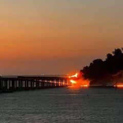 The bridge connecting occupied Crimea to Russia was blown up and on fire: video