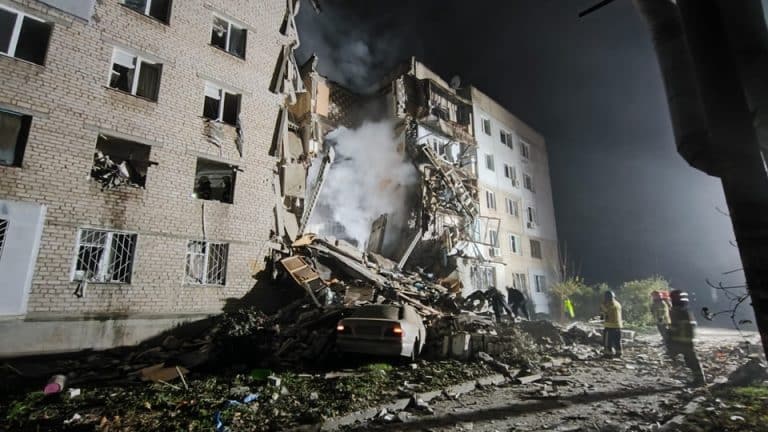 Russians hit a five-story building with rockets in Ukraine’s southern city, 6 civilians died